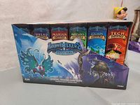 Front angle of the Light Seekers Awakening official trading card game six-pack sealed box showing all starter deck types.
