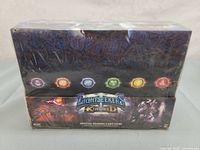 Photo of six Lightseekers Kindred Starter Deck boxes, shrink-wrapped and showing front artwork and symbols.