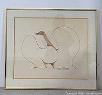 Framed print of a dancing goose artwork on a wall showing entire piece including frame and matte.
