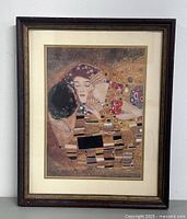 Full view of framed print in dark wooden frame with mat and double border around print