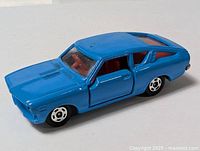 Left side view of blue die-cast Sunny 1400 GX model car