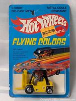 Front view of sealed Hot Wheels CAT Forklift on card