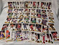 Wide view of laid-out 1987-88 OPC hockey cards showing variety of players and teams
