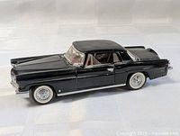 Left front side view of black 1956 Continental Mark II die-cast model