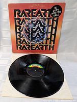 Front cover displaying Rare Earth typography and DJ Copy sticker