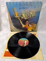 Front sleeve partially open with vinyl visible