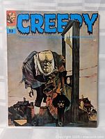 Front cover showing title, issue number 23, artwork