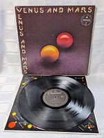 Front cover showing album art with spheres