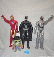 Full lot showing Iron Man, Batman, Cyborg 12" figures and Hulk Funko Pop figure
