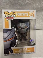 Photo of Fortnite Omega Funko Pop figure in box showing figure and packaging details.