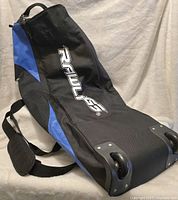 Photos of a new Easton rolling bat bag showing details of the wheels, Rawlings logo, and shoulder strap