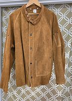 Front view of the men's cowhide leather welding jacket, tan suede finish with snap buttons and collar strap.