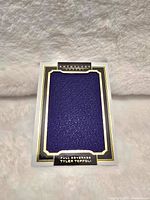 Front of the Tyler Toffoli NHL card with large purple jersey swatch and black/gold border.