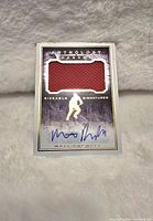 Front of the signed hockey card showing red jersey swatch, Matt Puempel's autograph, and Anthology design