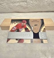 Front view of the Todd Bertuzzi NHL Upper Deck jersey card showing player image and embedded fabric swatch