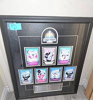 Full view of the framed NHL Stanley Cup Champions collectible showing seven trading cards, Stanley Cup logo, and text plaque.