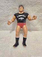 Front view of vintage Don Muraco LJN wrestling figure showing face, torso, and lower body with details of clothing and paint.