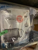 Braun drip coffee maker in original packaging showing front with special value label.