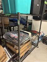 Full view of the shelving unit loaded with various items showing size and structure.