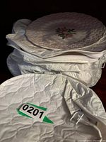 Stack of 6 vintage Spode Copelands china plates wrapped securely in padded white fabric with a labeled tag '0201'.