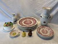 Full lot showed three Royal Staffordshire bread and butter plates with red floral pattern, six Mason's Vista dinner plates with similar red pattern, a tall white Rosenthal vase with gold and floral decor, Carlton Ware small handled dish in cream, Goebel beehive and bear condiment shakers, and ESD Japan covered cheese dish with painted fruit.