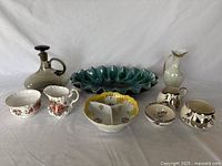 Photo showing all items including lusterware pitcher, oval flared dish, condiment set, and others spread on flat surface