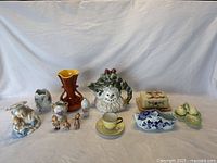 Full view of all porcelain and pottery items showing arrangement and variety.