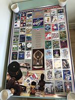 Full view of the framed 1991 World Series poster showing the entire collage and items placed around it.