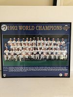 Front view of the framed 1992 Toronto Blue Jays World Champions poster showing the team photo and text.