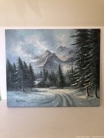 Full view of Jamieson signed landscape painting on canvas, showing mountain, snowy pine trees, and cabin.