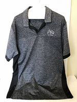 Front view of the Nike Aria Las Vegas golf shirt showing embroidered logo on chest and shirt design with black side panels.