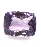 Close-up front view of cushion cut amethyst showing purple hues and faceting detail.