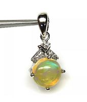 Front view of the pendant showing the multicolor opal gemstone and zircon accents, attached to the metal bail.