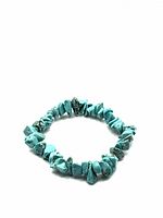 Photo of the turquoise tumbled stone chip bracelet showing the full circular shape and natural veining of the stones.