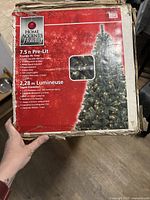 Box front side showing Home Accents Holiday brand, 7.5 ft pre-lit Franklin Fir Christmas tree with 500 clear lights specifications.