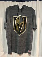 Front view of the gray short sleeve hoodie T-shirt with large Golden Knights logo.