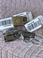 Three new brass cutaway key locks including standard and serrated styles, each with packaged keys from 'SPARROWS'. Locks have barcode stickers on the packaging boxes.