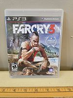 Front view of the PS3 Far Cry 3 game case showing cover art and branding.