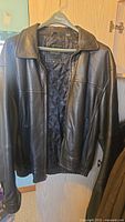 Front view of Moore's genuine leather jacket size XLT with visible collar, quilted liner and pockets