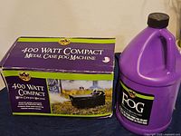 Box and bottle showing 400 watt fog machine and fog juice