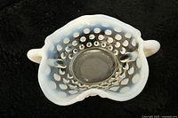 Top view showing the clear hobnail pattern with opalescent white ruffled edge and side handles.