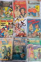 Vintage comic books featuring Disney characters like Mickey Mouse, Old Yeller, The Beagle Boys, Howdy Doody, Winnie the Pooh and puzzles-themed comics.