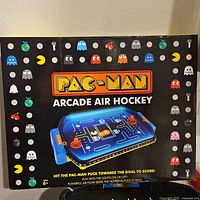 Box with Pac-Man Arcade Air Hockey branding showing the game artwork and logo