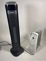 NOMA and AIRWORKS electric heaters together showing general condition and size relation