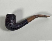 Full view of the vintage Dunhill tobacco pipe showing the shell briar finish and bent stem.
