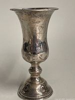 Front view of the sterling silver Kiddush cup showing etched pattern and flared rim.