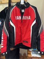 Front view of Yamaha red and black jacket with Yamaha logos