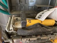 DeWalt DW682 plate joiner inside its dust-covered carrying case, showing the yellow body, black handle, and base plate.