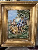 Framed Limoges porcelain painting with gold aged frame exhibiting wear and crackling.