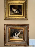 Both paintings hanging on wall, top two-bunny and bottom single-rabbit